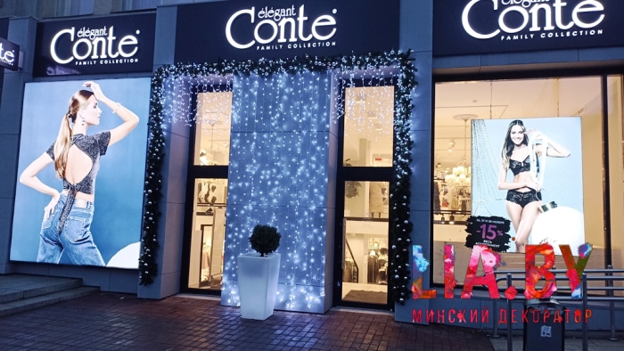 Украшение фасадов магазинов Conte к новому году световыми и хвойными гирляндами