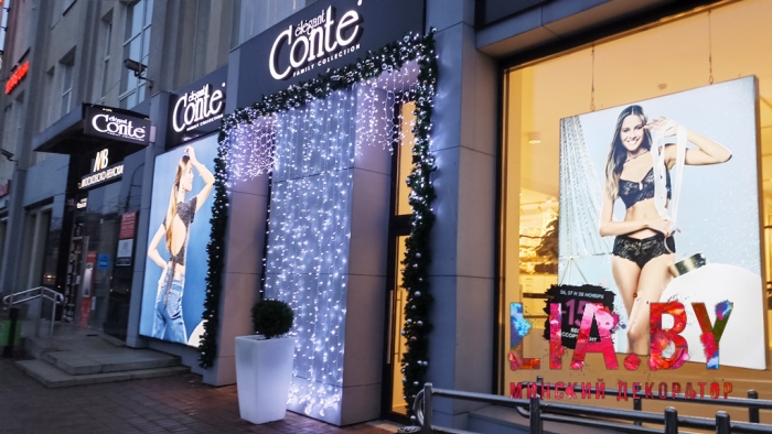 Украшение фасадов магазинов Conte к новому году световыми и хвойными гирляндами
